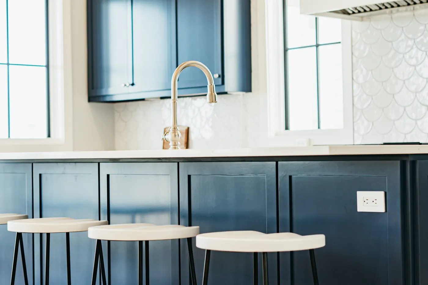 Custom blue cabinetry with brass hardware