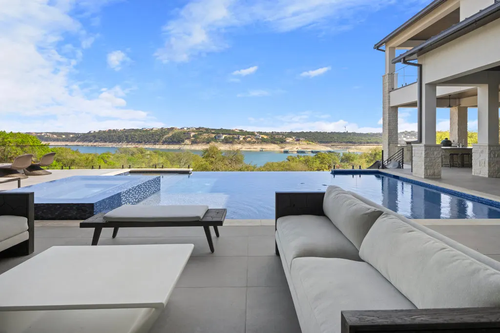 An infinity pool looking out over Lake Travis at a Spicewood home